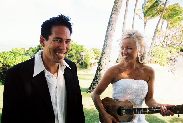 the bride hold a ukulele after they got married
